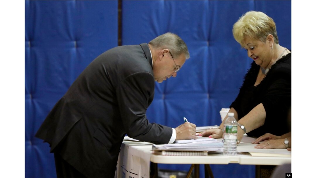 U.S. Sen. Bob Menendez checks in before casting his vote in the New Jersey primary election, June 5, 2018.