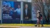 Pedestrians walk past campaign posters of presidential candidates Dragan Primorac and Zoran Milanovic ahead of the presidential election in Zagreb, Croatia, on Dec. 26, 2024.