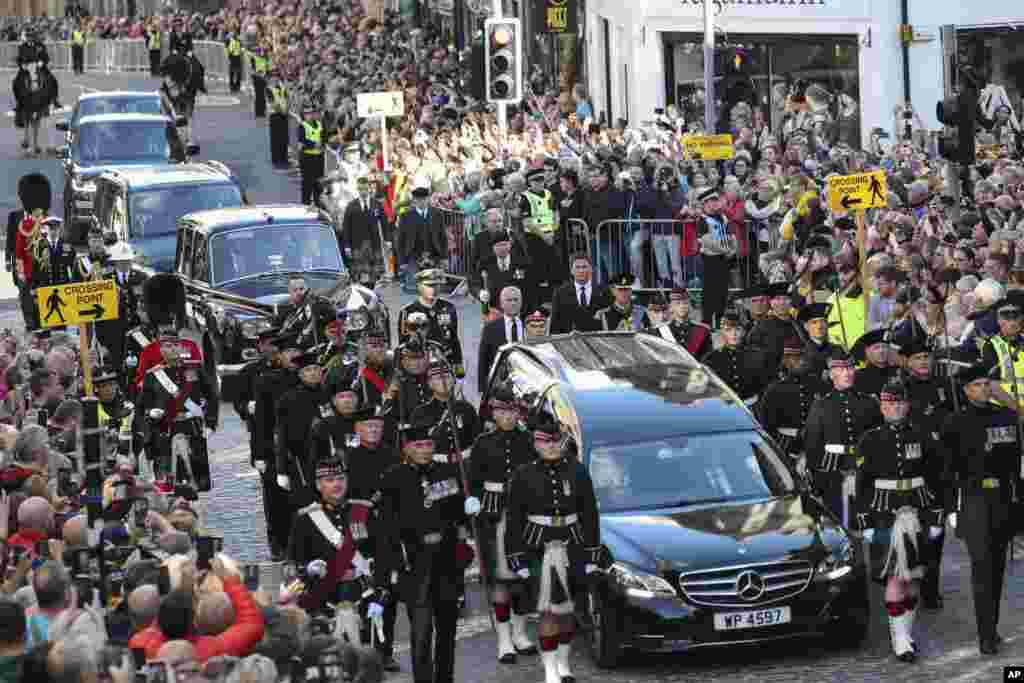 The procession with the coffin of Queen Elizabeth II heads up the Royal Mile to St. Giles' Cathedral in Edinburgh, Sept. 12, 2022.