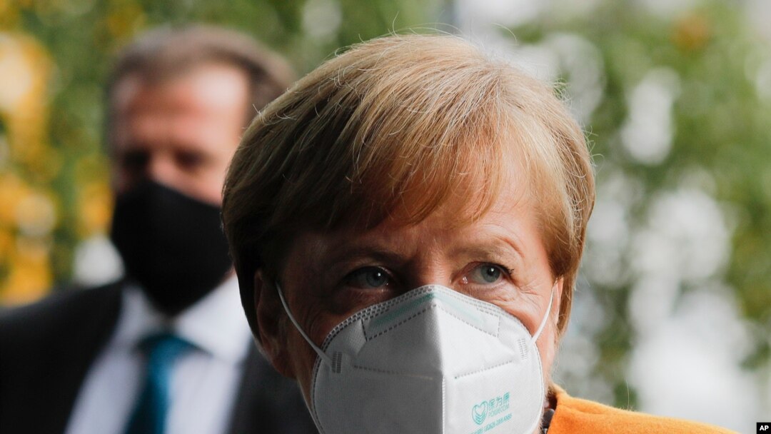 German Chancellor Angela Merkel arrives about a news conference German Government's corona policy in Berlin, Germany, Nov. 2, 2020.