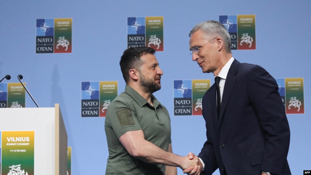 NATO Secretary-General Jens Stoltenberg shakes hands with Ukrainian President Volodymyr Zelensky after a joint press conference on the sidelines of the NATO Summit in Vilnius, July 12, 2023.