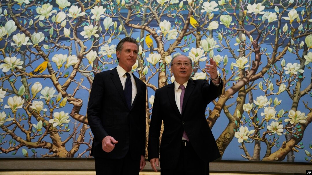 California Governor Gavin Newsom, left, stands next to Beijing Party Secretary Yin Li during a meeting in Beijing, Oct. 26, 2023. Newsom was on a weeklong tour of China.