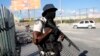 FILE - A National Police officer patrols an intersection in Port-au-Prince, Haiti, Jan. 26, 2024. After multiple delays and court challenges, it appears that the deployment of Kenyan police officers to Haiti may be set for June 25, according to reports. 