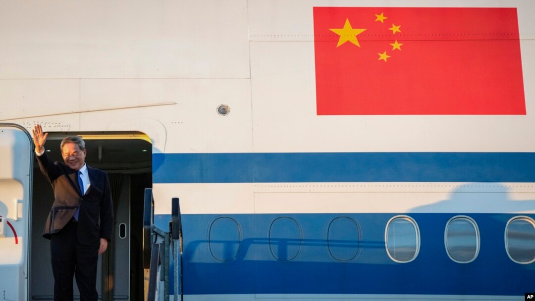Chinese Premier Li Qiang waves on his arrival at Adelaide Airport, Australia, June 15, 2024.
