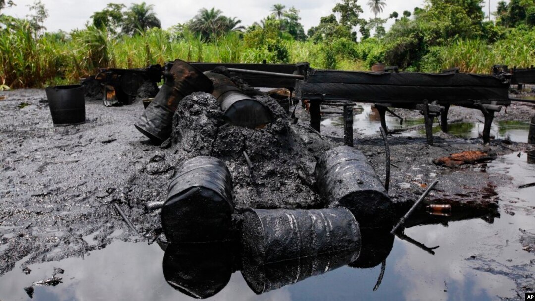 FILE- An abandoned illegal oil refinery is seen after it was raided by the Nigerian navy at Bayelsa, Nigeria, May 18, 2013. Nigerian officials have said the country loses $700 million every month as a result of oil thefts.