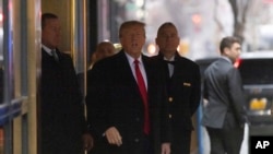 Former U.S. President Donald Trump leaves his apartment building in New York, Jan. 26, 2024.