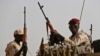 FILE - Sudanese soldiers from the Rapid Support Forces unit secure an area in the East Nile province, Sudan, June 22, 2019. Calls to end Sudan's current 14-month war have come and gone with little effect.