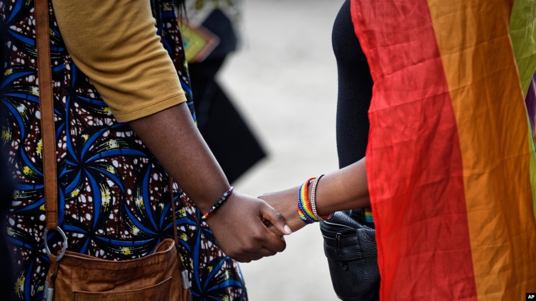 FILE - LGBTQ activists commiserate after a court upheld laws that criminalize same-sex relations in Nairobi, Kenya, on May 24, 2019. Kenya and Nigeria are among the more than 30 African countries that criminalize homosexuality.
