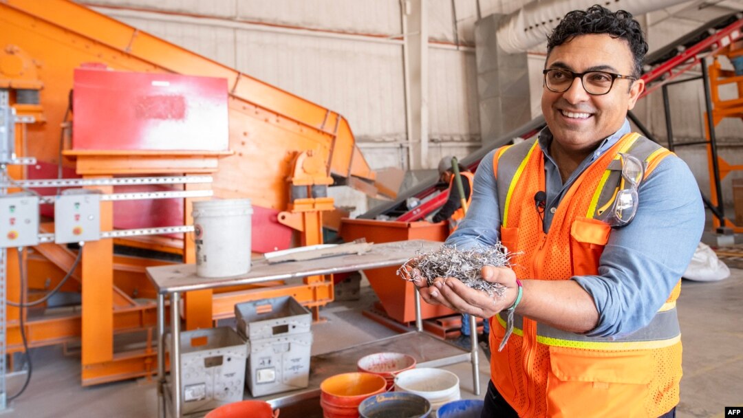 We Recycle Solar Chief Executive Officer Adam Saghei shows metals removed from solar panels to be recycled at the We Recycle Solar plant in Yuma, Arizona, Dec. 6, 2023.