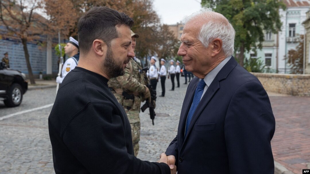 This handout photo released by Ukraine's Presidential Press Service on Oct. 1, 2023, shows Ukraine's President Volodymyr Zelenskyy (L) shaking hands with EU foreign policy chief Josep Borrell during a ceremony marking Defenders Day of Ukraine in Kyiv.