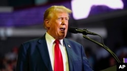 FILE - Republican presidential candidate former President Donald Trump speaks at a campaign rally at Temple University in Philadelphia, June 22, 2024.