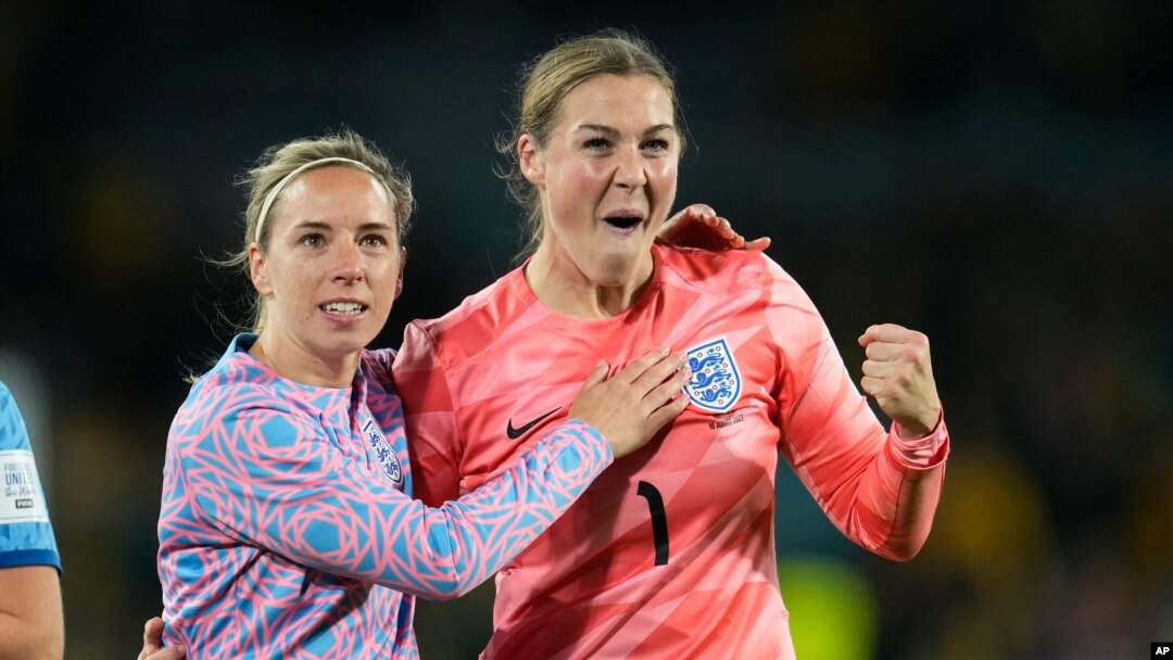 England's goalkeeper Mary Earps, right, and Jordan Nobbs celebrate as they won the Women's World Cup semifinal soccer match between Australia and England at Stadium Australia in Sydney, Australia, Aug. 16, 2023. 