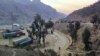 Stranded trucks loaded with supplies for Afghanistan park in a terminal alongside on a highway, Feb. 21, 2023, after Afghan Taliban rulers closed a key border crossing point Torkham, in Pakistan's district Khyber along the Afghan border.