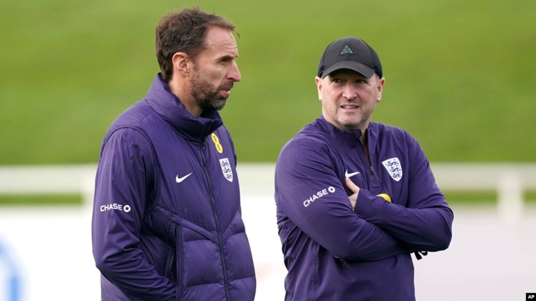 England manager Gareth Southgate, left, with assistant Steve Holland leads a training session ahead of Saturday's friendly soccer match against Brazil, at St. George's Park, Burton upon Trent, England, March 22, 2024.