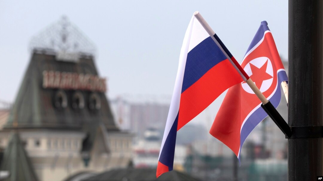 FILE - Flags of Russia and North Korea are seen in front of the central railway station in Vladivostok, Russia, April 24, 2019, ahead of a summit in the city between Russian President Vladimir Putin and North Korean leader Kim Jong Un.