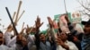 Supporters of former Pakistani Prime Minister Imran Khan chant slogans, after police postpone the arrest of Khan, outside his home in Lahore, Pakistan, March 15, 2023. 