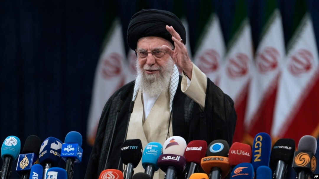 FILE - Iranian Supreme Leader Ayatollah Ali Khamenei waves after voting during the presidential election in Tehran, Iran, June 28, 2024. On Saturday, the day after an Israeli airstrike on Beirut, he said Israel is committing "shameless crimes" against children, not combatants. 