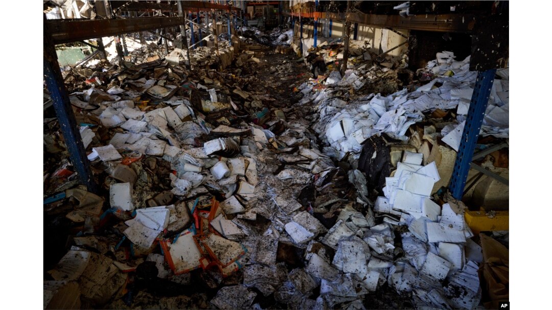 Burnt books are seen in a damaged workshop of Ukraine's largest printing house ruined in Thursday deadly Russian missile attack that killed seven civilians in Kharkiv, Ukraine, May 24, 2024.