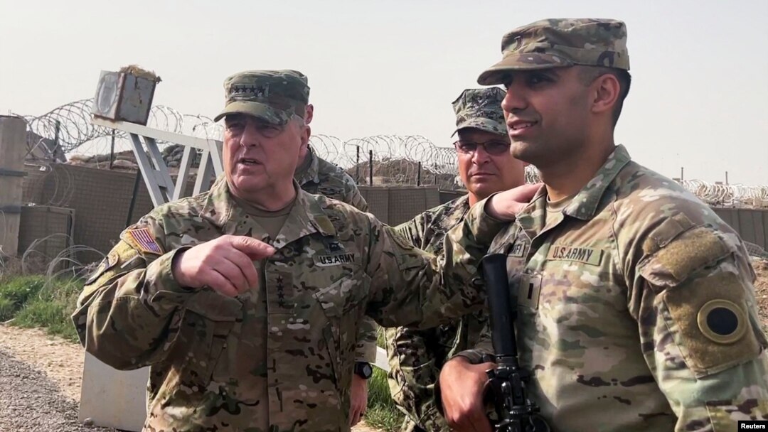 U.S. Joint Chiefs Chair Army General Mark Milley speaks with U.S. forces in Syria during an unannounced visit, at a U.S. military base in northeast Syria, March 4, 2023.