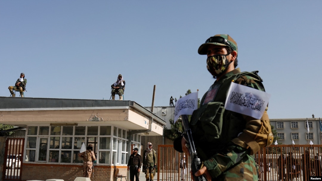FILE - Taliban soldiers stand guard at the second-anniversary ceremony of the takeover of Kabul by the Taliban in Kabul, Afghanistan, August 15, 2023.