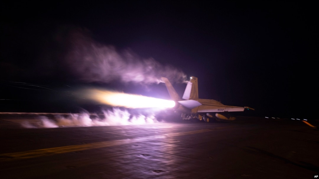 FILE - This image provided by the U.S. Navy shows an aircraft launching from the USS Dwight D. Eisenhower during Red Sea flight operations, Jan. 22, 2024. U.S. and British militaries have been bombing multiple targets of Iran-backed Houthis in Yemen.