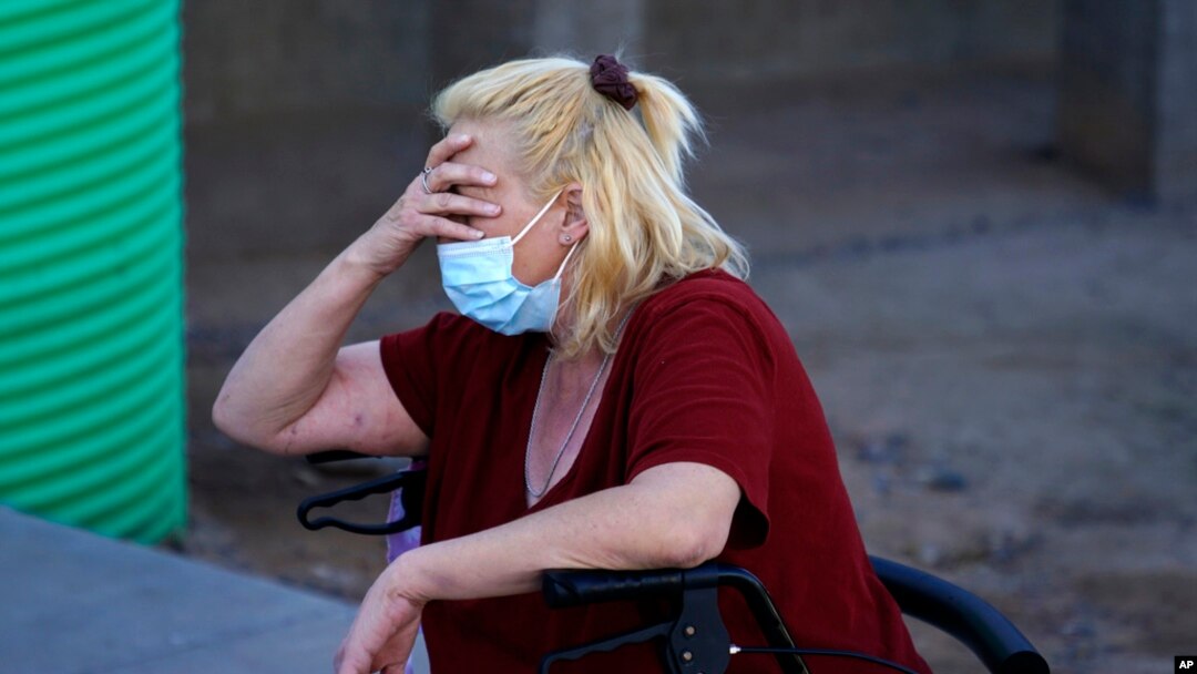 FILE - Karla Finocchio, 55, talks about her homeless days when she lived in her truck on Jan. 24, 2022, in Phoenix.