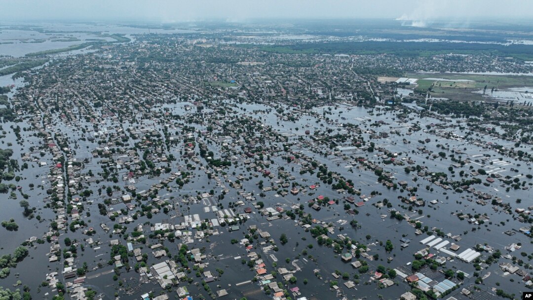 FILE - Houses are submerged in the town of Oleshky, Ukraine, June 10, 2023, from the destruction of the Kakhovka Dam on June , on the Dnipro River in Ukraine. 
