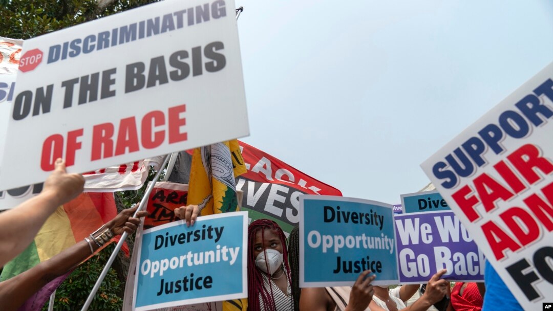People protest outside of the Supreme Court in Washington, June 29, 2023. 