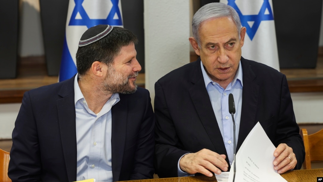 FILE - Israeli Prime Minister Benjamin Netanyahu, right, speaks with Minister of Finance Bezalel Smotrich during the weekly cabinet meeting at the Defense Ministry in Tel Aviv, Israel, Jan. 7, 2024.