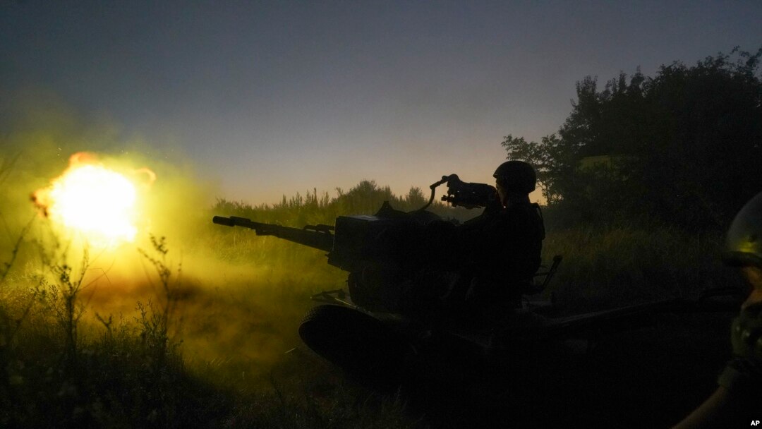 Ukrainian servicemen fire to Russian positions from anti-aircraft gun in Kharkiv region, Ukraine, Aug. 24, 2022.