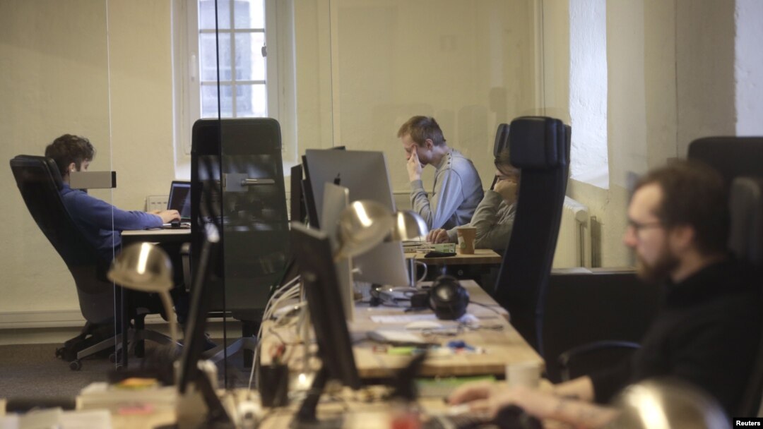 FILE - Journalists work in the independent, Russia-focused, media start-up Meduza office in Riga, March 30, 2015. "Within a few days ... it is possible that there will be no independent media left in Russia," read a statement published to Meduza's website March 3, 2022. 