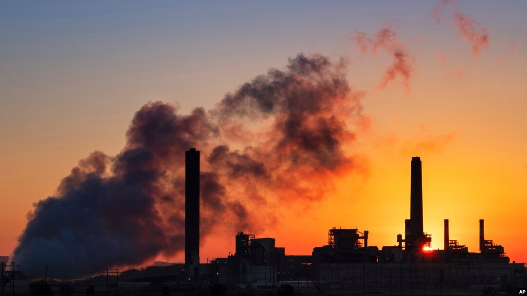FILE - The Dave Johnson coal-fired power plant is silhouetted against the morning sun in Glenrock, Wyo.