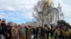 UN Secretary-General Antonio Guterres, fourth left, is seen during his visit to Bucha, on the outskirts of Kyiv, Ukraine, April 28, 2022.