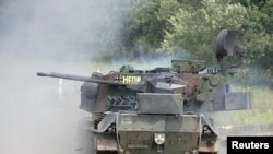 FILE - A German Gepard antiaircraft tank fires during a demonstration about 80 km south east of Hamburg, Germany, June 20, 2007. Germany will authorize the delivery of tanks to Ukraine, Defense Minister Christine Lambrecht said on April 26, 2022.