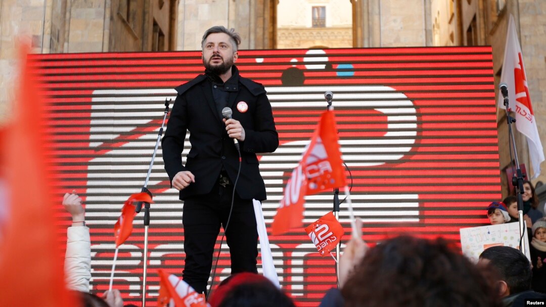 FILE - Nika Gvaramia, chief executive officer of Rustavi 2, attends a rally to support opposition TV channel Rustavi 2 in Tbilisi, Georgia, Feb. 19, 2017.