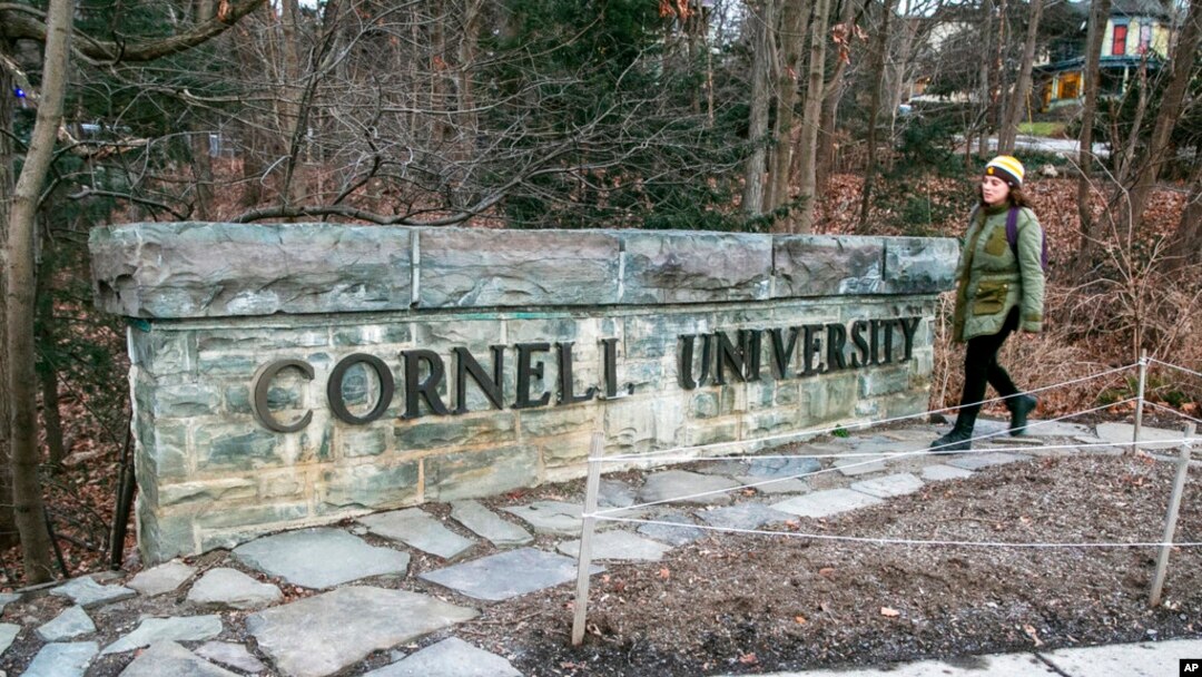 A woman walks by a Cornell University sign on the Ivy League school's campus in Ithaca, New York, Jan. 14, 2022. Cornell University administrators dispatched campus police to a Jewish center after threatening statements appeared on a discussion board, Oct. 29, 2023. 