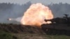 FILE - A Polish Leopard 2PL tank fires during a Defender Europe 2022 military exercise of NATO troops near Orzysz, Poland, May 24, 2022. 