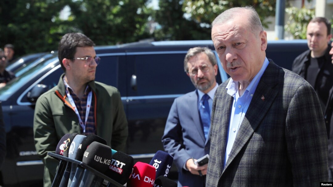Turkish President Recep Tayyip Erdogan talks to media as he leaves a mosque after Friday prayers in Istanbul, Turkey, May 13, 2022.