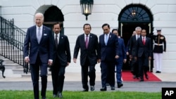 President Joe Biden and leaders from the Association of Southeast Asian Nations (ASEAN) arrive for a group photo on the South Lawn of the White House in Washington, Thursday, May 12, 2022. (AP Photo/Susan Walsh)