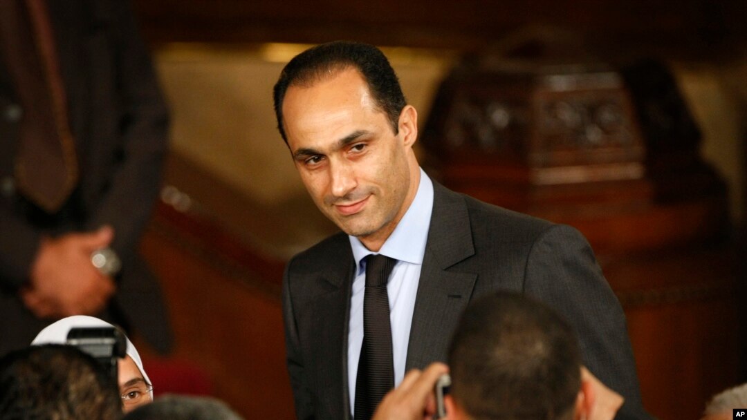 FILE - Gamal Mubarak, center, son of Egyptian President Hosni Mubarak, talks to guests prior to the speech of U.S. President Barack Obama at Cairo University in Cairo, Egypt, June 4, 2009.