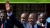 Kenya's President-Elect Uhuru Kenyatta gestures to supporters as he leaves the National Election Center where final election results were announced declaring he would be the country's next president, in Nairobi, March 9, 2013. 