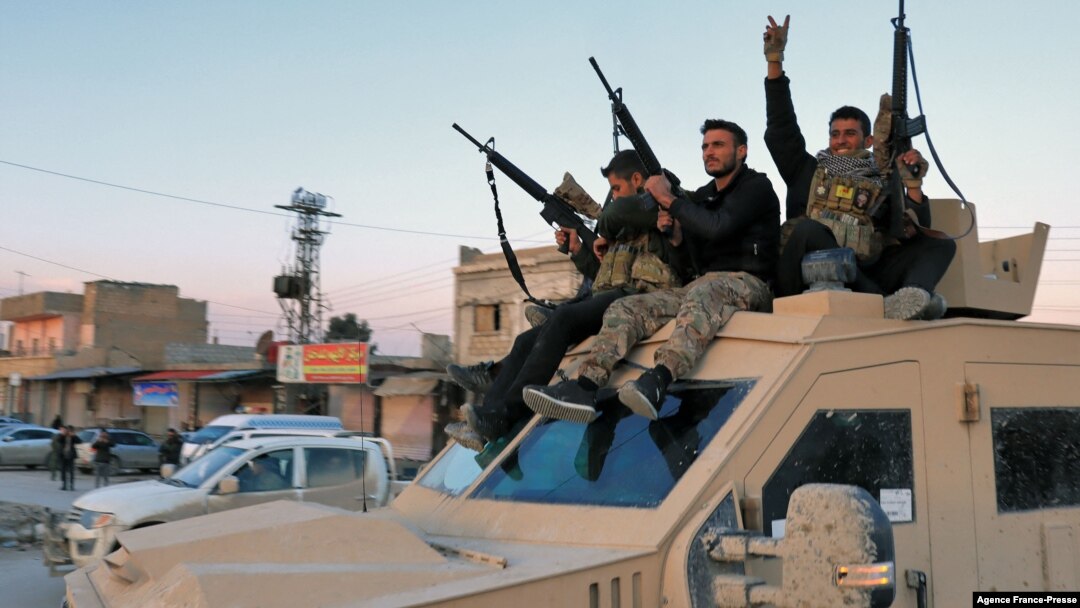 Members of the Syrian Democratic Forces (SDF) deploy outside al-Sina’a prison in Syria's northeastern city of Hasakah, Jan. 26, 2022.