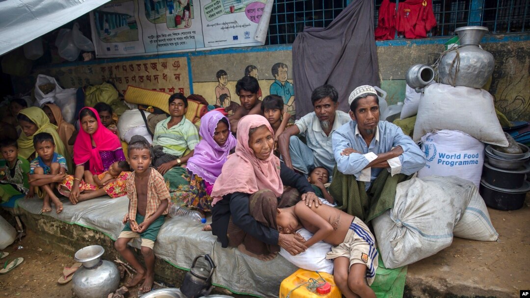 FILE - Rohingya Muslims, who crossed over from Myanmar into Bangladesh, rest inside a school compound at Kutupalong refugee camp, Bangladesh, Oct. 23, 2017. 