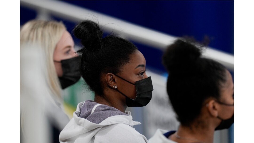 United States gymnast Simone Biles sits on the stands during the artistic gymnastics women's all-around final at the 2020 Summer Olympics, July 29, 2021, in Tokyo, Japan.