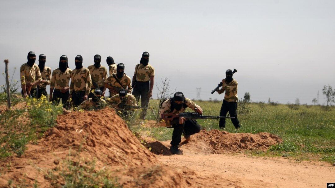 Rebel fighters members of the Liwa Brigade, of which Maher Rahhal was part, are seen training in the northeastern city of Deir Ezzor, on March 25, 2014.