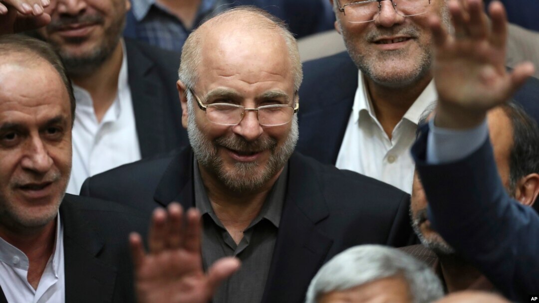 FILE - Mohammad Qalibaf, center, is surrounded by lawmakers after being elected as speaker of the parliament, in Tehran, Iran, May 28, 2020. Qalibaf registered his candidacy June 3, 2024, for the country’s June 28 presidential election.
