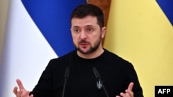 Ukrainian President Volodymyr Zelenskyy gestures as he speaks during a joint press conference with his Finnish counterpart following their talks in Kyiv, on Jan. 24, 2023.