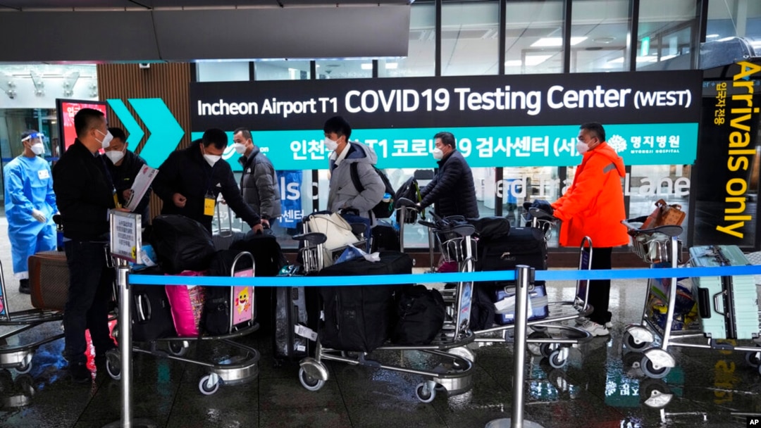 Passengers arriving from China arrive at a COVID-19 testing center at the Incheon International Airport in Incheon, South Korea, on Jan. 14, 2023. 