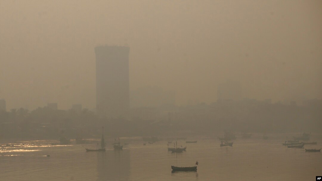 FILE - Morning smog envelops the skyline in Mumbai, India, Oct. 20, 2017.