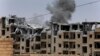 FILE - Smoke rises from a coalition airstrike on an Islamic State position, on the front line on the western side of Raqqa, northeast Syria, July 17, 2017.